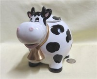 Chubby caricature cow teapot with big nose and double bell