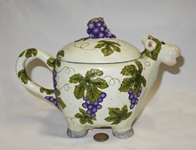 cow teapot with grapes and leaves, side