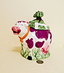 purple spotted cow teapot with tree on top