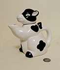 Sttting up, 'praying' b&w cow teapot