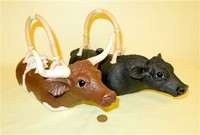 Christy Crews Dunn longhorn and Angus cow teapots